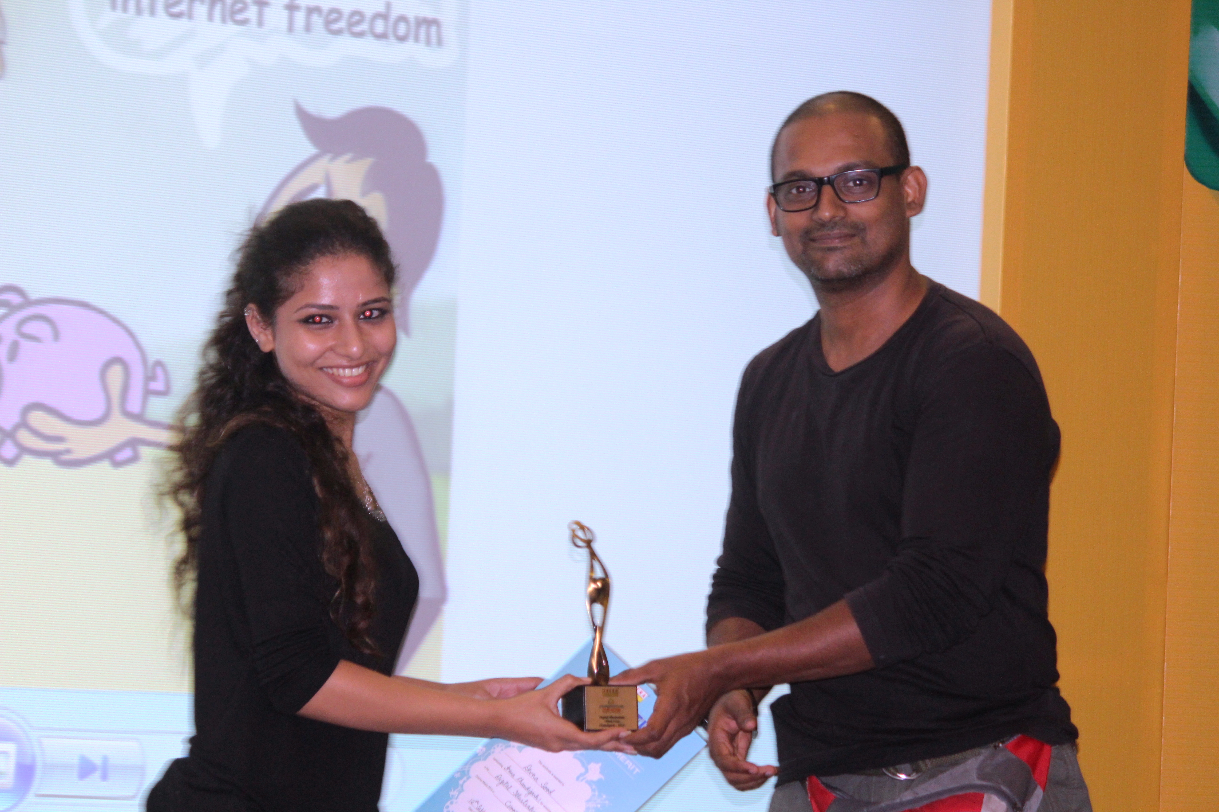 Devena Wins Award for Best Digital Illustrations. Devena receiving Award from Vaibhav More